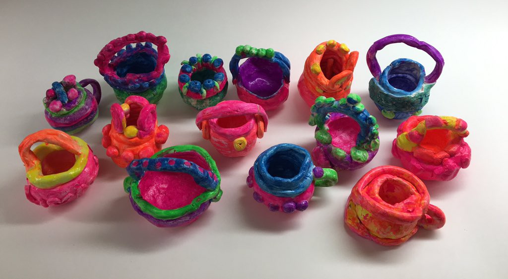 Ms. Johnson's 3rd grade finished painting and sealing their clay coil pots. Beautiful!