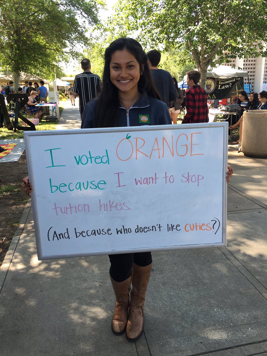 ucrorangeparty's tweet photo. The polls are still down, but come to our table at the belltower and take a picture of why you #VotedOrange! 🍊 https://t.co/mHZh0wwEAE