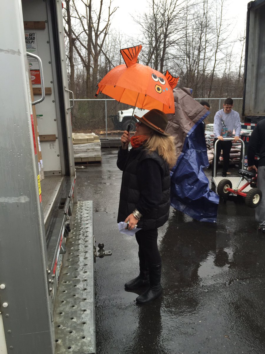 ArtistsAndPeace's tweet photo. Nothing beats a goldfish umbrella to shield yourself from the rain #AFWP #packingforpeace #tanzaniabound https://t.co/PAX9XTzOeL
