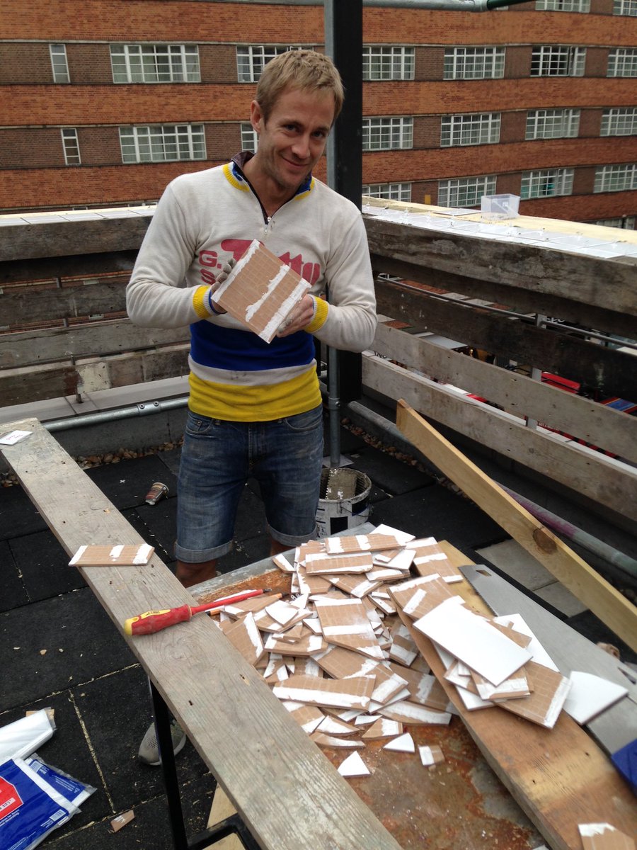 WoodyBearLDN's tweet photo. Cutting tiles by hand. Last tile in hand, needed one more to finish. Not a great success rate #oneintwenty #rooftop https://t.co/8g4i3pRSkL