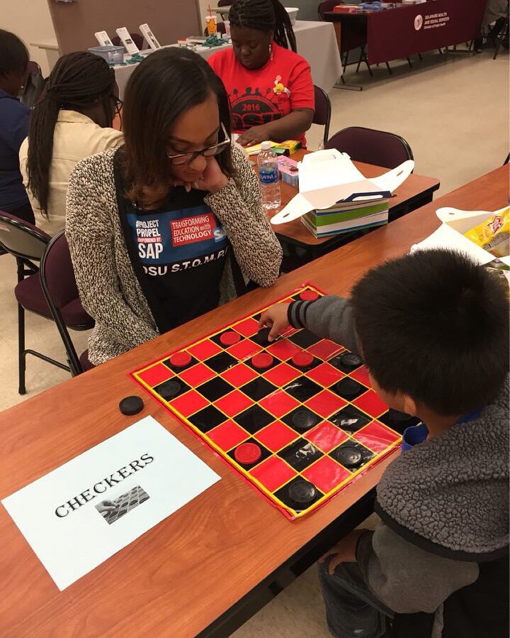 DSUSTOMPP's tweet photo. Shereen playing checkers during the fitness and fun day in Wilmington! #InspiredDayofService #STOMPP #WeLiveToGive https://t.co/TXGBO3DraY