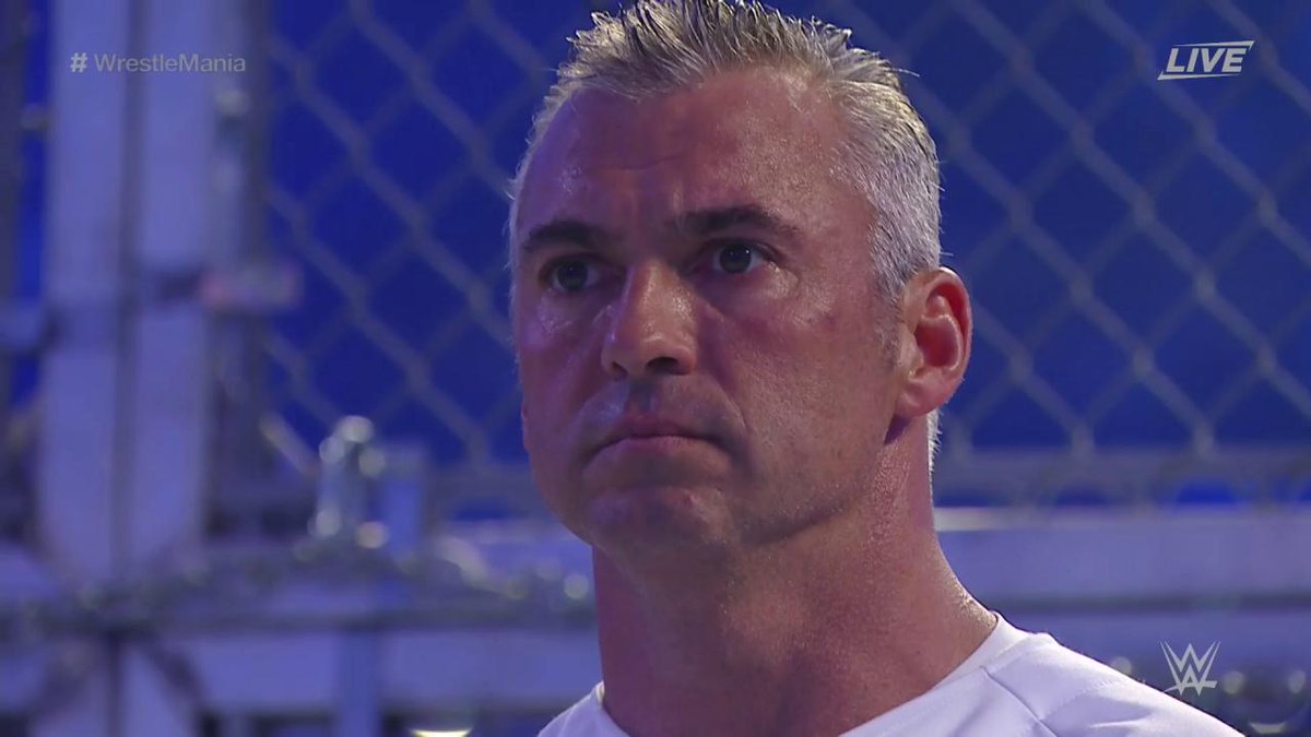 WrestleMania's tweet image. A FOCUSED @ShaneMcMahon looks on in awe of his @WrestleMania opponent The #Undertaker... #WrestleMania