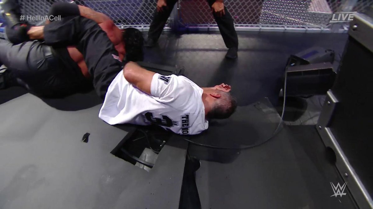 WrestleMania's tweet photo. There goes the announce table as The #Undertaker sacrifices himself to breaker @ShaneMcMahon's hold! #WrestleMania https://t.co/T5mQ4vQWOT