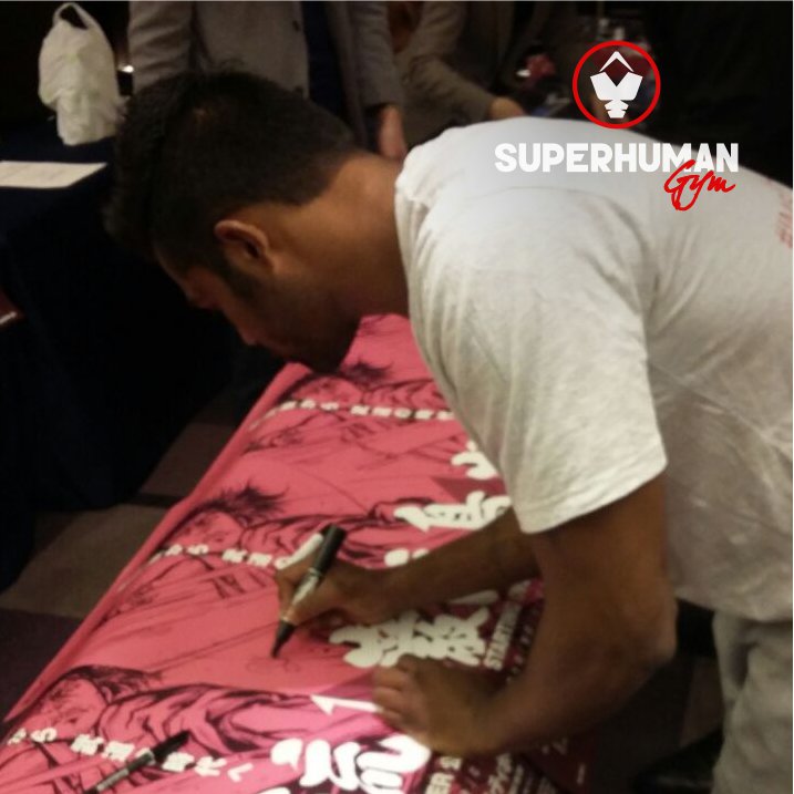 SuperhumanGym's tweet photo. Our trainer Bharat signing official posters of Ganryujima for sponsors and auction https://t.co/gBcUMvF40y