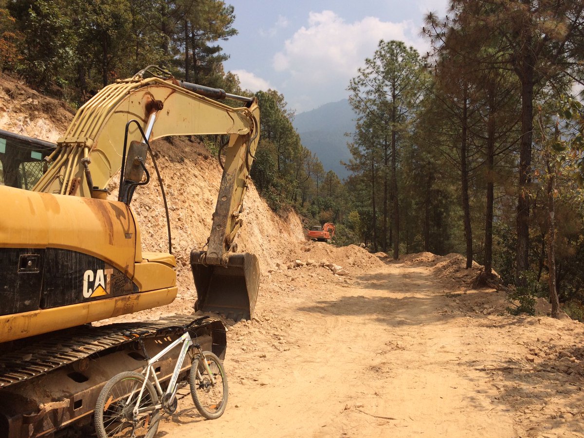 MikeLavender's tweet photo. Improving the road to supply building materials for damaged homes in Lele. Now a great mountain bike ride! https://t.co/w1WDBhAjKn