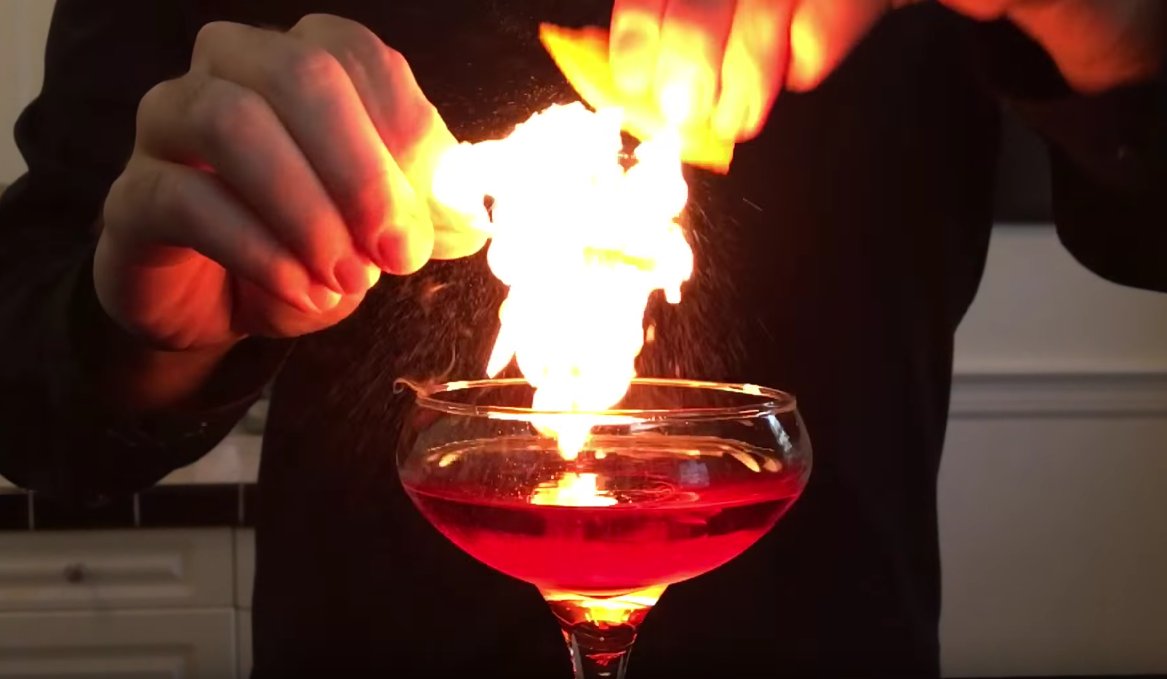 foodandwine's tweet photo. How to flame an orange peel, the impressive (and easy) cocktail trick. #FWx https://t.co/MeKxh3zv7b https://t.co/CwXRYY86fa