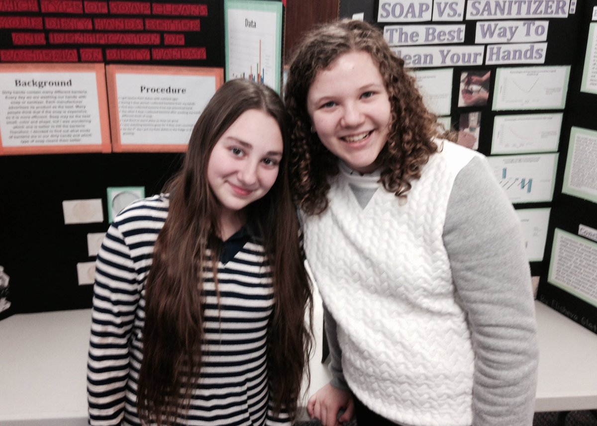 8th grade science fair - impressive models and theories at each table!