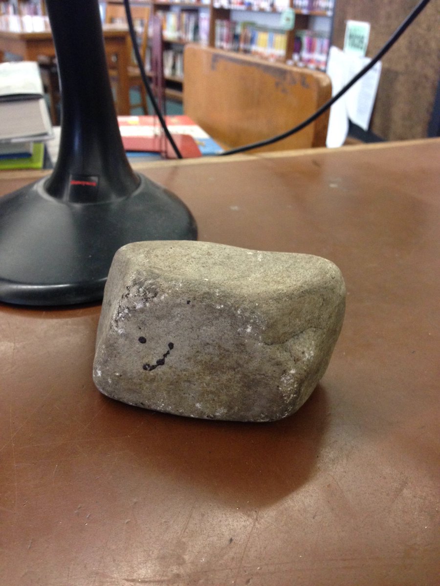 Girl_Librarian's tweet image. Why is there a rock on my circ desk? #libraryquestions