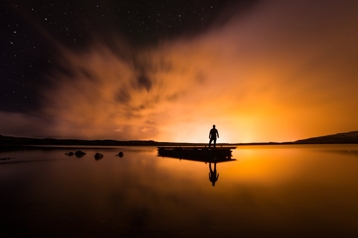 arnark's tweet image. Just you, the still lake and an explosion of light all around your dark shadow #iceland #photography #portrait #sky