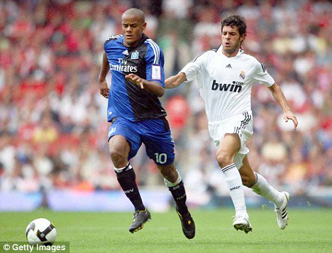footballs_past's tweet photo. Kompany chased by Real Madrid's Miguel Torres while in action for Hamburg https://t.co/hGHnnI8JOI