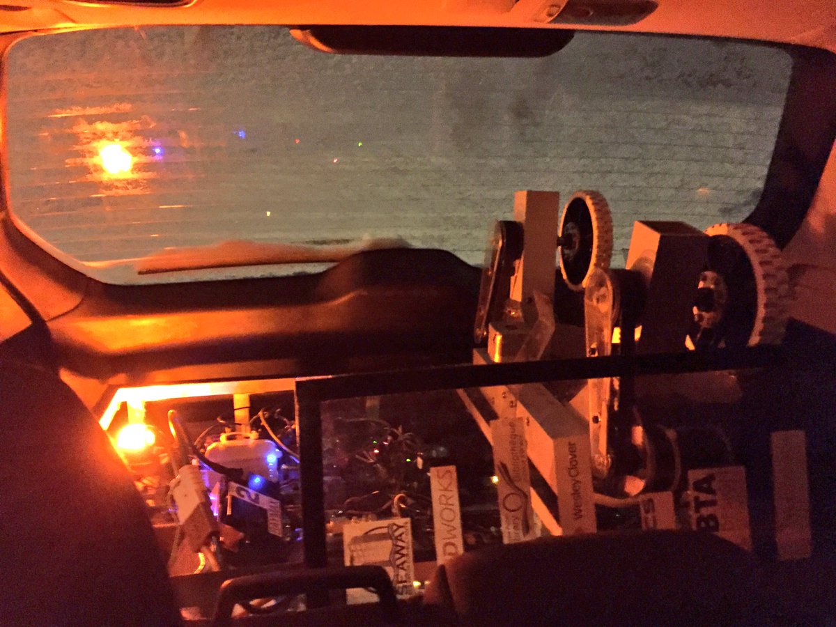 Sometimes one finds oneself in odd places. Like working on a robot from the back seat of a car in a snowstorm...