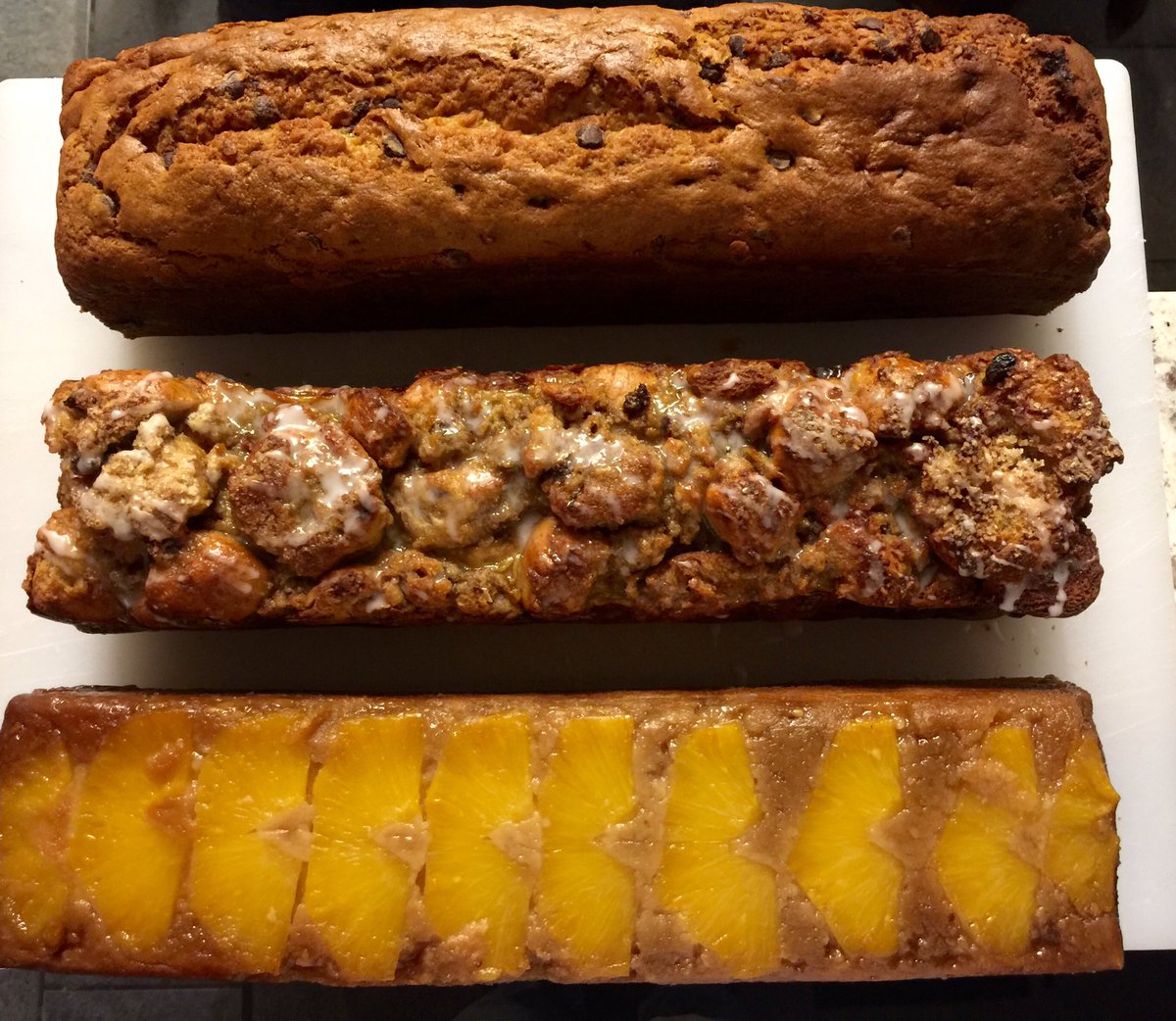 BakerNosh's tweet photo. Happy National Coffee Cake Day!Banana chocolate chip, cinnamon raisin bread pudding, and upside down pineapple https://t.co/IdKKLwrTaY