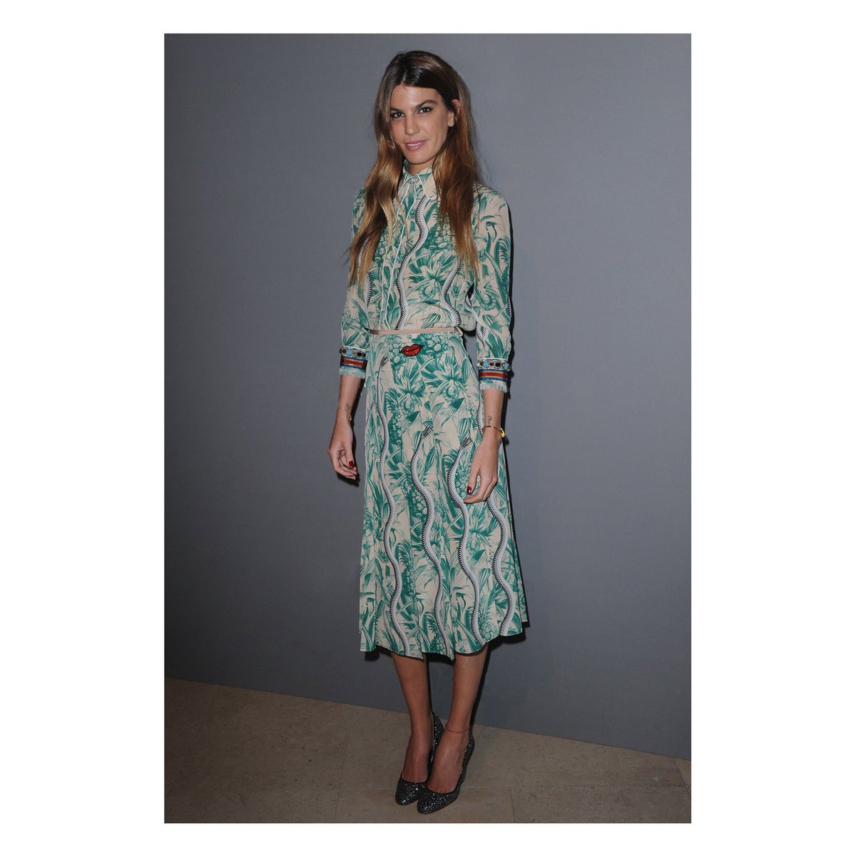 To an event in Paris, Bianca Brandolini wears a #GucciSS16 snake printed silk blouse and a matching skirt.