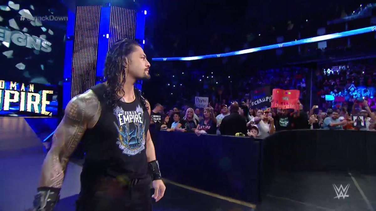WWEUniverse's tweet photo. The new champion is taking it all in as he appears before the @WWEUniverse in Houston! #SmackDown @WWERomanReigns https://t.co/EV76XCNvNy
