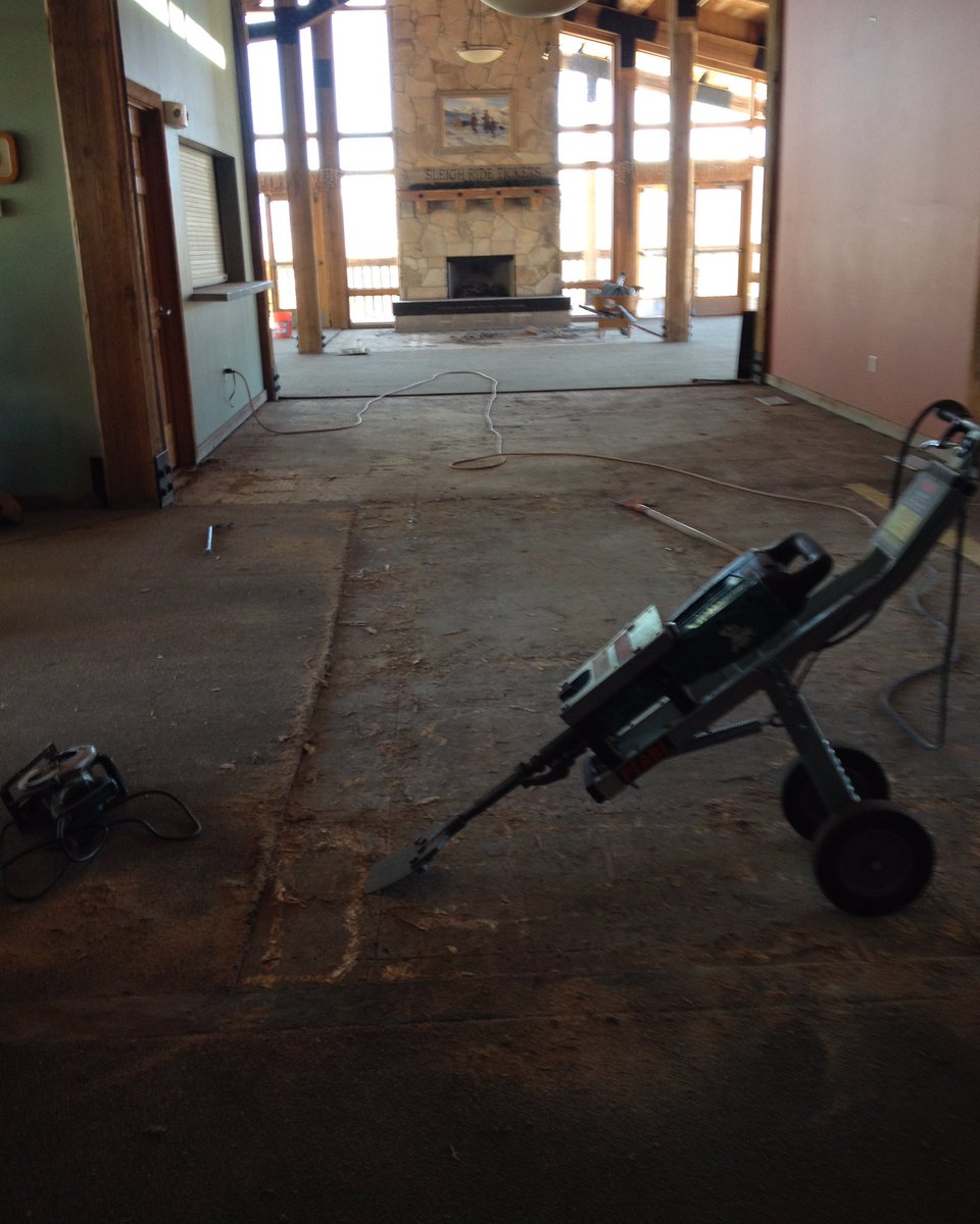 Work continues removing the old tile and carpet from the lodge