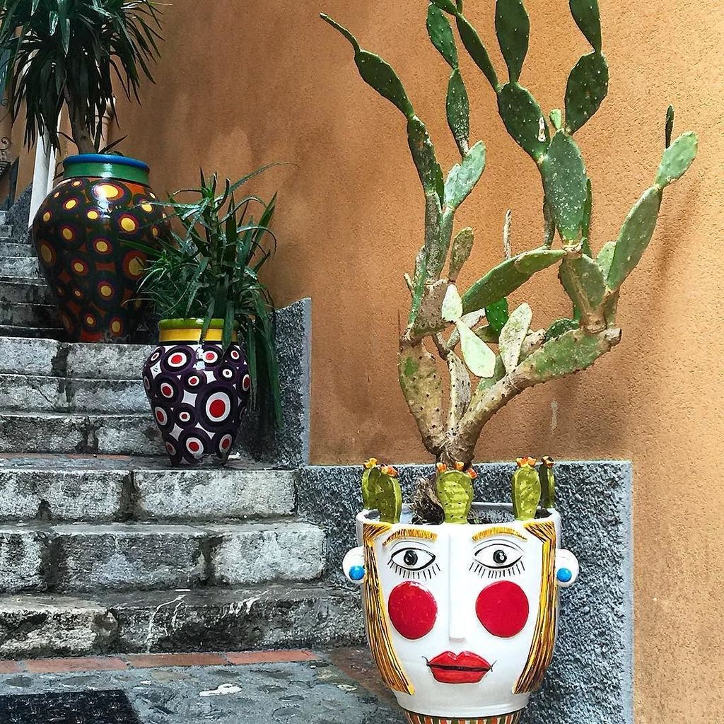 Pointsandtravel's tweet photo. The many faces of #Sicily come alive on the streets of Taormina in ceramic folk art #SplendorsofSouthItaly https://t.co/TpOc3QgGjJ