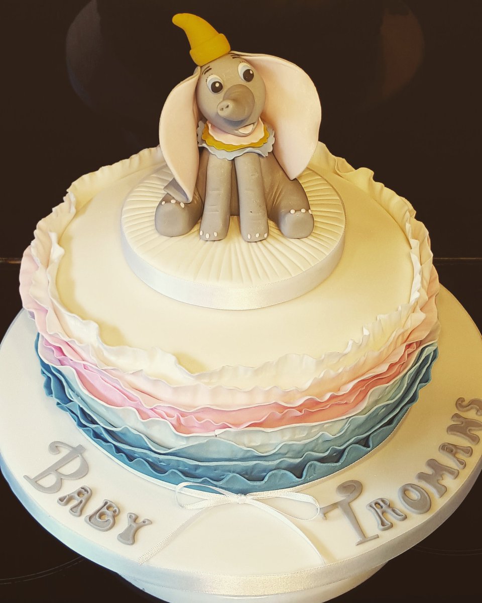 Baby shower ruffle cake with a handmade dumbo topper. #rufflecake #dumbo