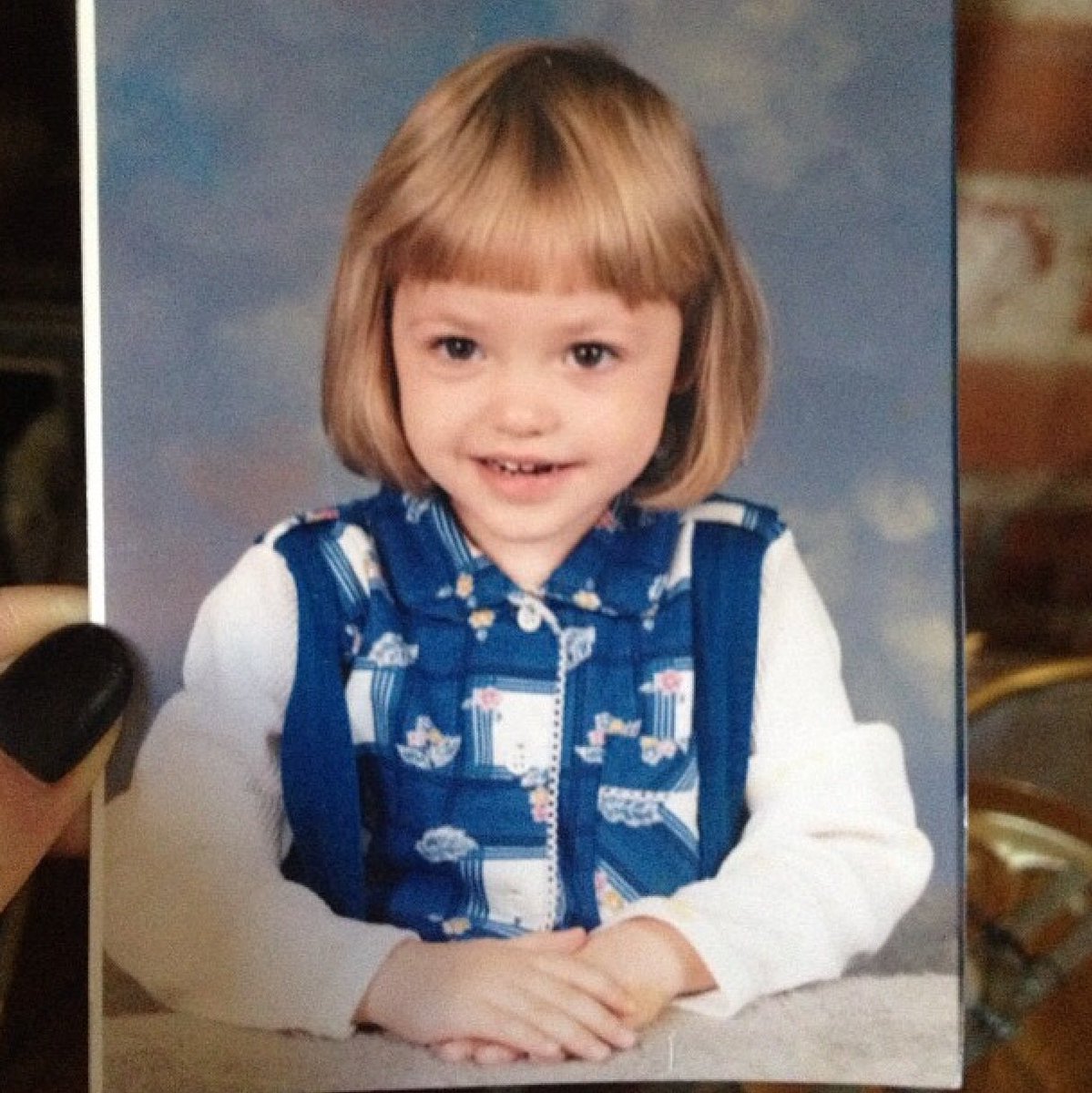 Here's my favorite sister when she was tiny and idolized me, but wore unfortunate shirts. #NationalSiblingsDay