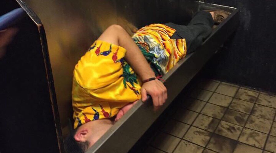 RT_America's tweet photo. #MeanwhileInSouthCarolina: Drunk college student falls asleep in urinal https://t.co/dN9oakq80J https://t.co/oZfUjz286D