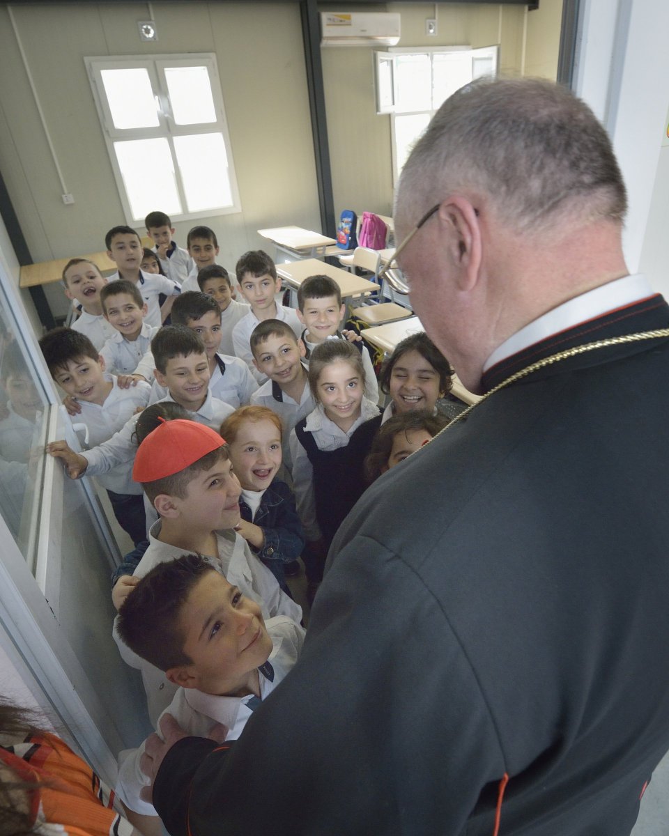James Martin, SJ (@jamesmartinsj) on Twitter photo Great photo: <a href="/CardinalDolan/">Cardinal Dolan</a> loans his zucchetto to a child in a school for children displaced by war, in Iraq. Great photo: <a href="/CardinalDolan/">Cardinal Dolan</a> loans his zucchetto to a child in a school for children displaced by war, in Iraq.