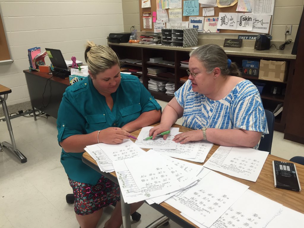 Bolton and Pounders collaborating as they look at student work...rationalizing square roots. #FCSLearn