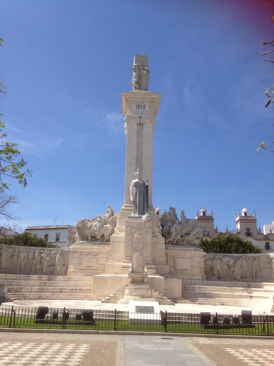 Recent Erasmus visit to Cadiz; monuments to 1812 Constitution and a call for open borders on town hall.