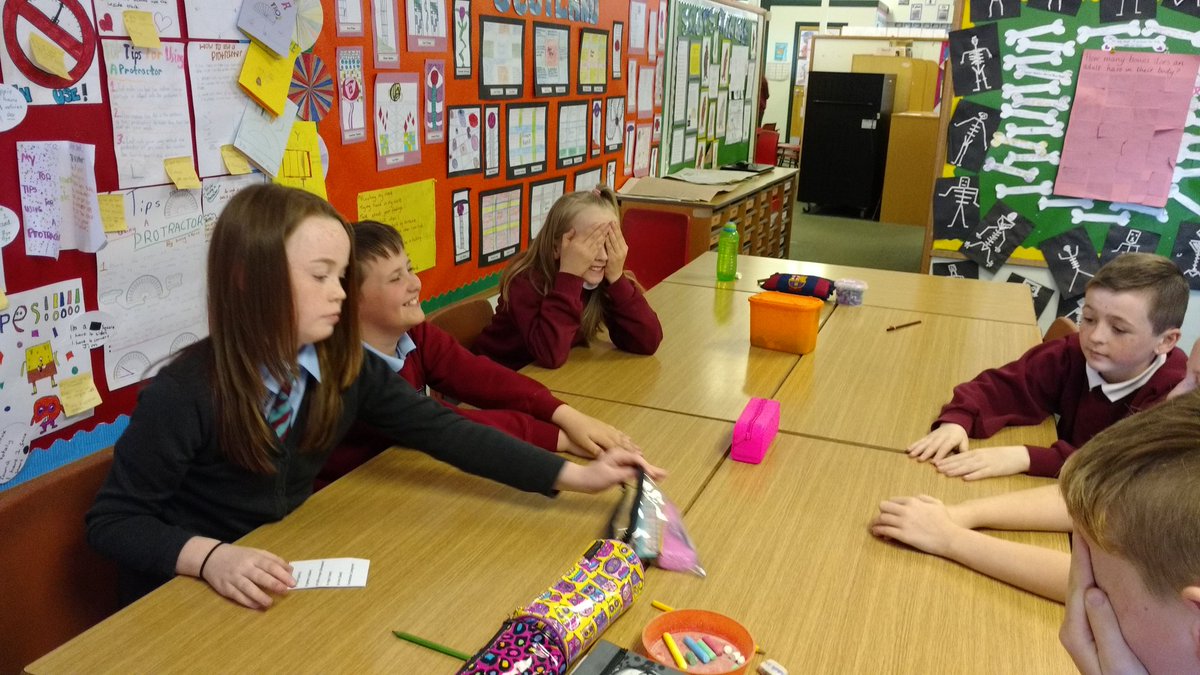 'Fermez les yeux!'. St Peter's pupils playing 'Kim's game' with real classroom objects.