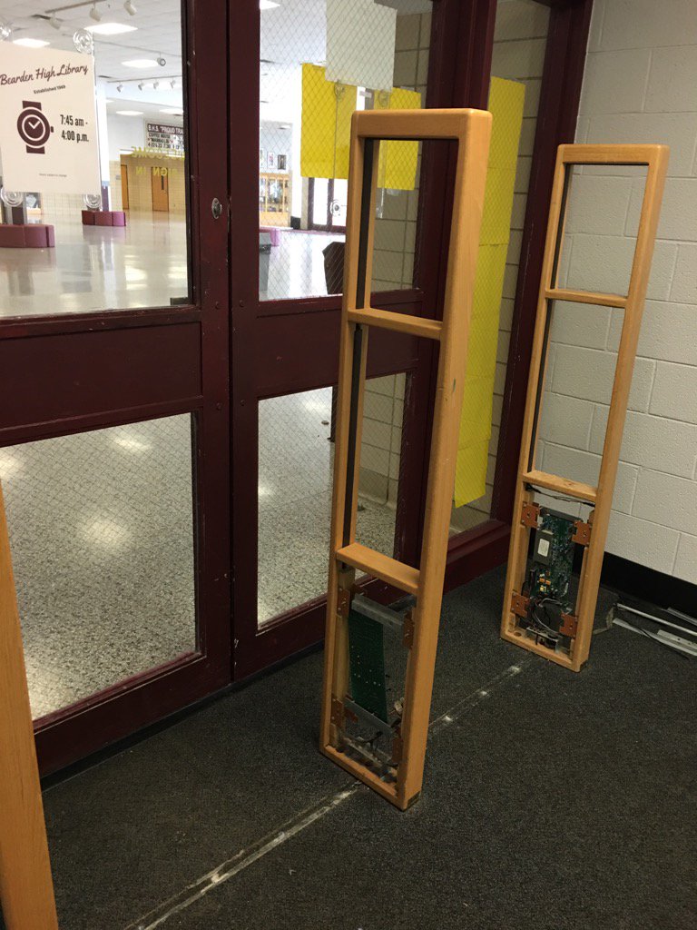 BHSDawgLibrary's tweet photo. The old security system is coming out today. #byefelicia #booksareforuse #ranganathan https://t.co/TweERCGIq0