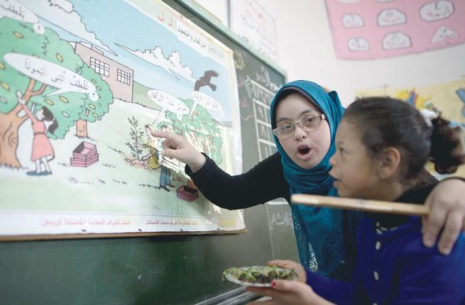 ChildrenofPeace's tweet photo. GAZA Hiba Al Sharfa has become Gaza's first teacher with Down’s Syndrome, after a lifelong effort to achieve this. https://t.co/8jdoSoiRrl