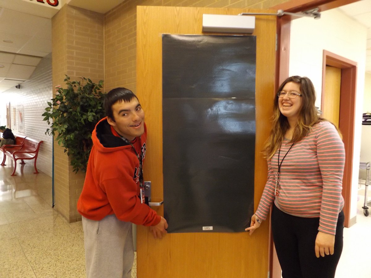 150 lockdown window covers measured cut laminated and installed for all classroom and office doors in the building