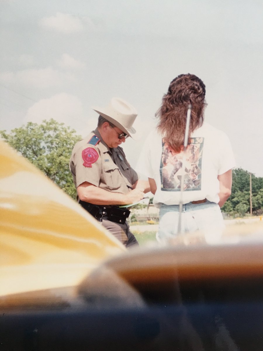 romero's tweet photo. POST 5000. On my way to Austin in my Testarossa and...  #speeding #wolf3d #jorts #mullet https://t.co/zWYUwQu15s