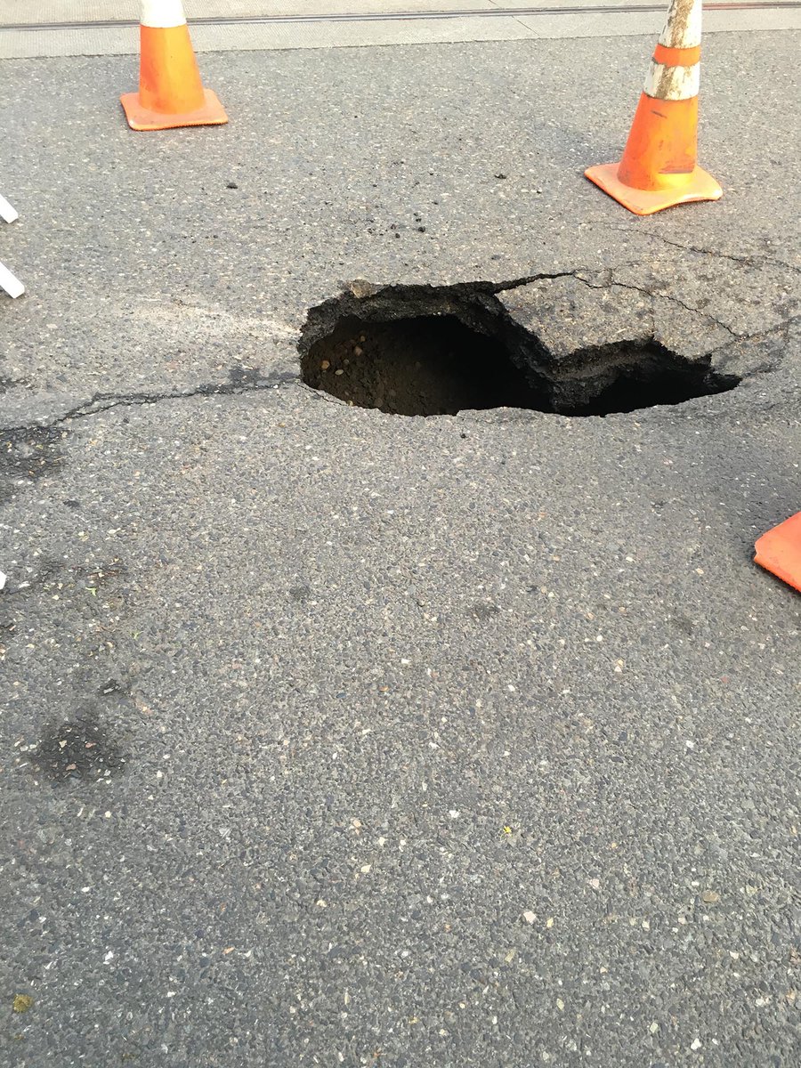 ScottCLandis's tweet image. Decent sized hole in the road near NW Johnson and 11th. #pdx #pdxroads #infrastructure
