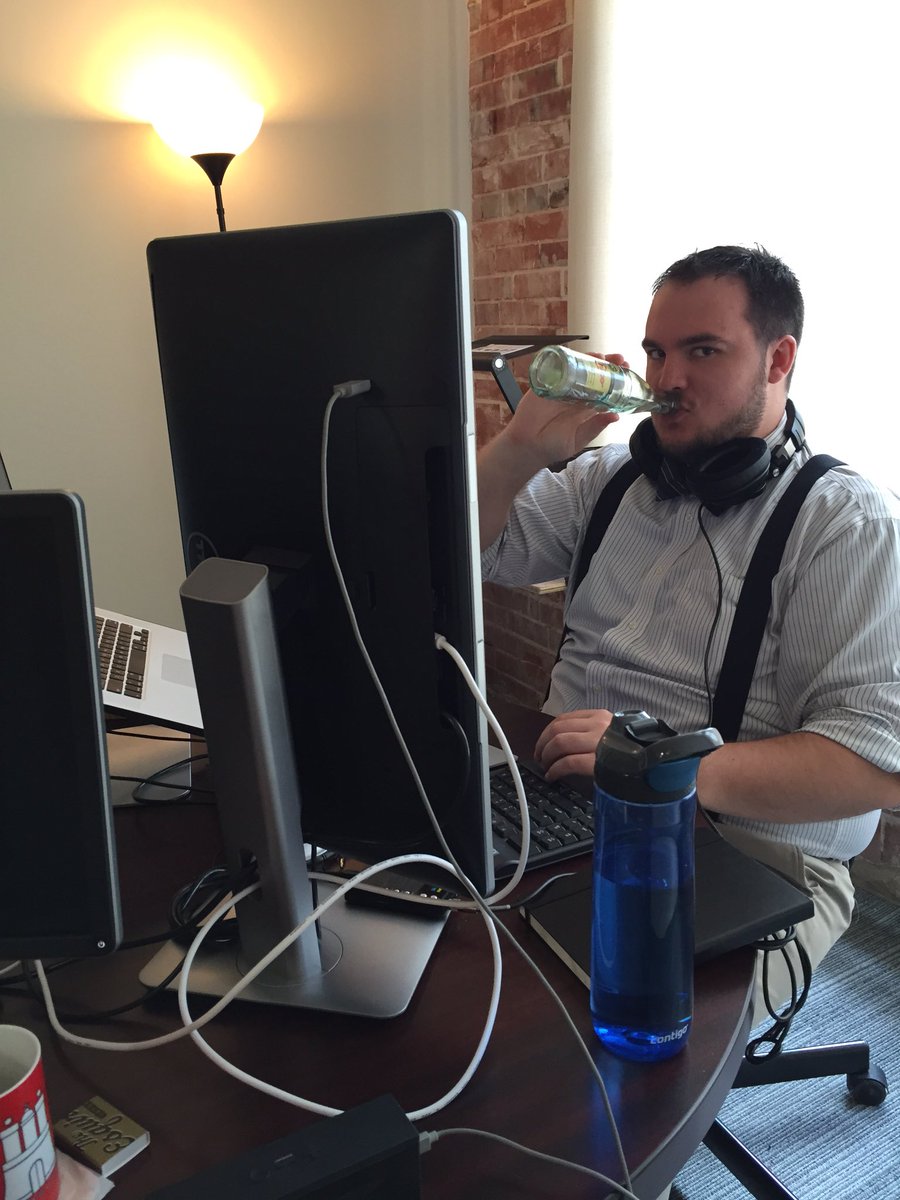 GrokInteractive's tweet photo. While working @joshfreemanIO understands it's important to stay well hydrated #TGIF #topochico #verticalmonitor https://t.co/XFJMDrxhso