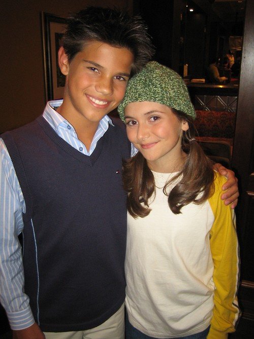 Taylor Lautner with his hair cut around his ears