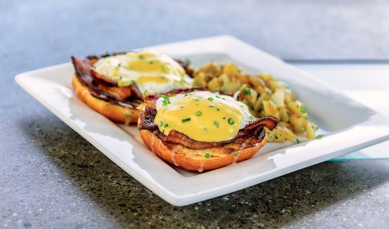 TGIF! Visit us for a rooftop brunch and try one of our all time favorites, the Devil's Dozen Donut benedict!