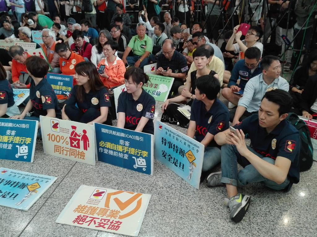 TravelFoto's tweet photo. #HongKongCabinCrewFederation #Sitin for #AirportSafety #Protest #Against #SpecialTreatment for #HKChiefExec at #HKIA https://t.co/08X1IgRKkq