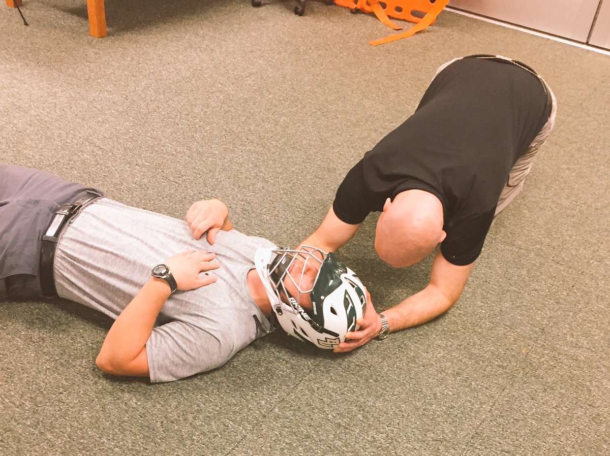 Staff got together to work on helmet removal practice for the up coming spring sports symposium ! Are u registered?