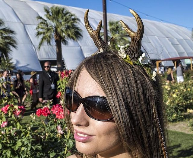 LAist's tweet photo. Coachella Fashion, Day 2: Someone Wore Antlers https://t.co/yakqkUcahG https://t.co/8gGrrxWn2X