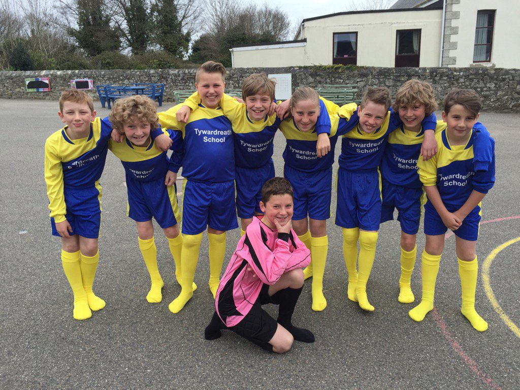 Very proud players showing off the new school football kit!
