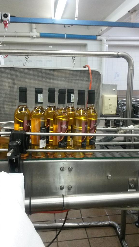 OrangeRiverWine's tweet photo. #botteling #new #strawwine #2015 looking golden and good.@OrangeRiverWine @emilejoubert https://t.co/1JMcPkeKMM