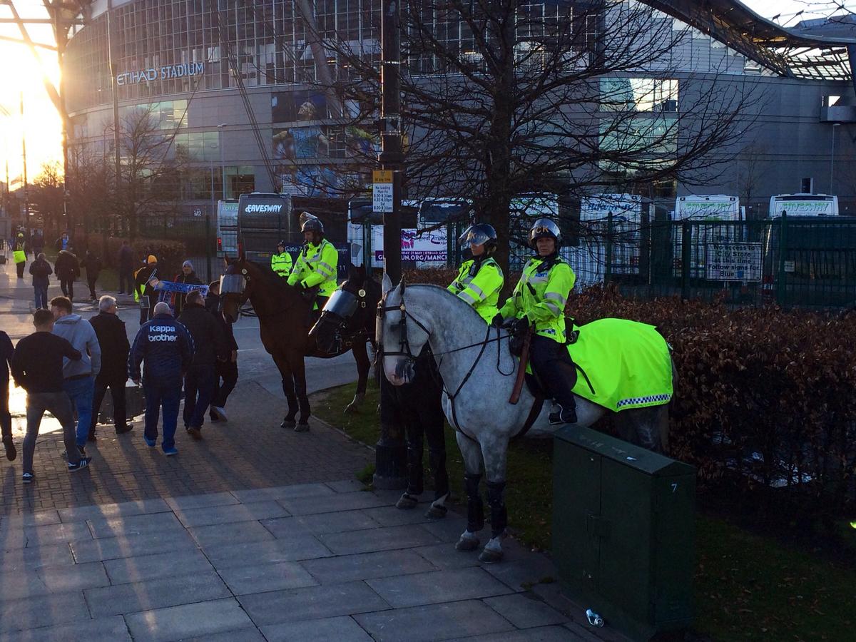 GMPChorlton's tweet photo. Sunshine as Steele, Pip & Harvey await kickoff @MCFCvsReal Madrid, great atmosphere, good luck guys! #gmpmountedunit https://t.co/D9rWk3Pm2I