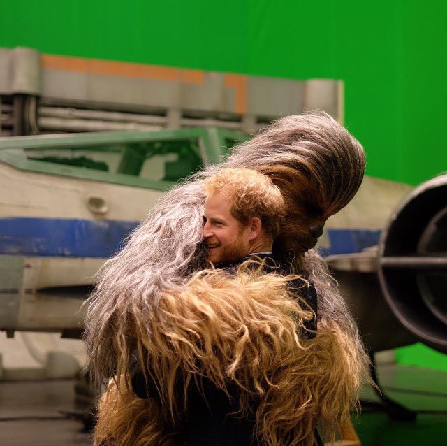 WHOmagazine's tweet photo. Prince Harry makes a new friend! 
[Photo: Kensington Palace]
#princeharry #starwars #chewbacca https://t.co/udJSTw6DVH