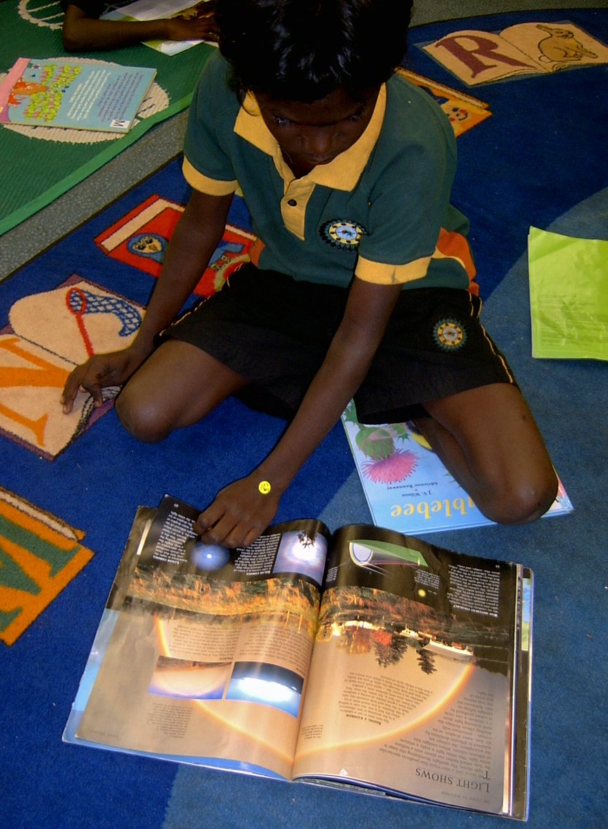 OLSHTCC's tweet image. @OLSHTCC students enjoy reading different books at the library! #MakeABookEmotional #Australia #Wadeye #NT