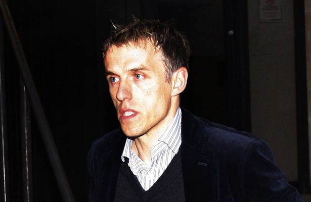 Phil Neville looks like the kinda guy that has his picture taken with the DJ while he's gurning his nut off.