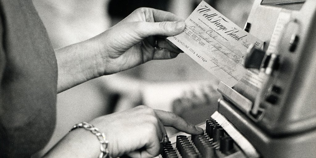 WellsFargo's tweet image. #TBT: In 1968, a team member enters information from a check for “fast” processing. How technology changes!