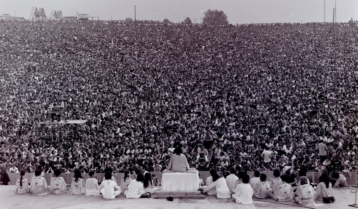 HistoryInPics's tweet photo. Opening ceremony at Woodstock with Swami Satchidananda giving the opening speech, 1969. Photo by Mark Goff. https://t.co/uek2o2ndup