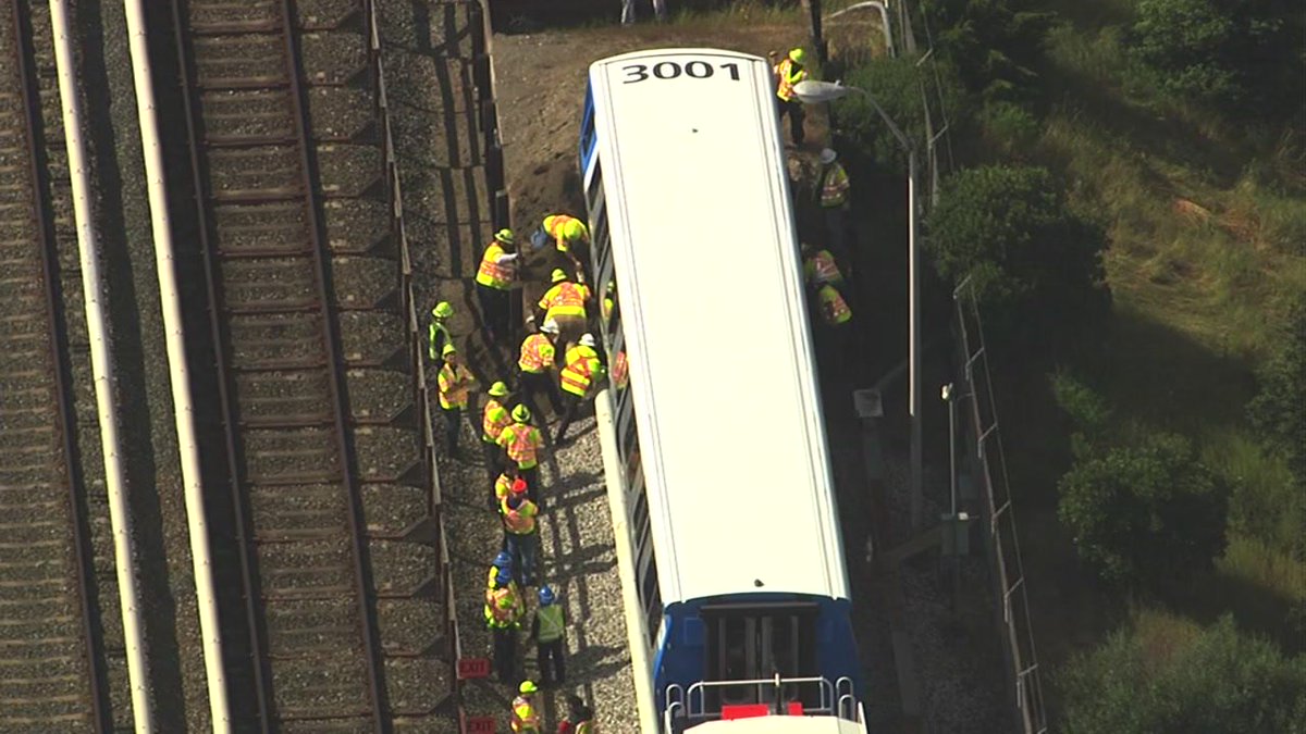 Photos: crews work to dig out new #bart train stuck in dirt during ...