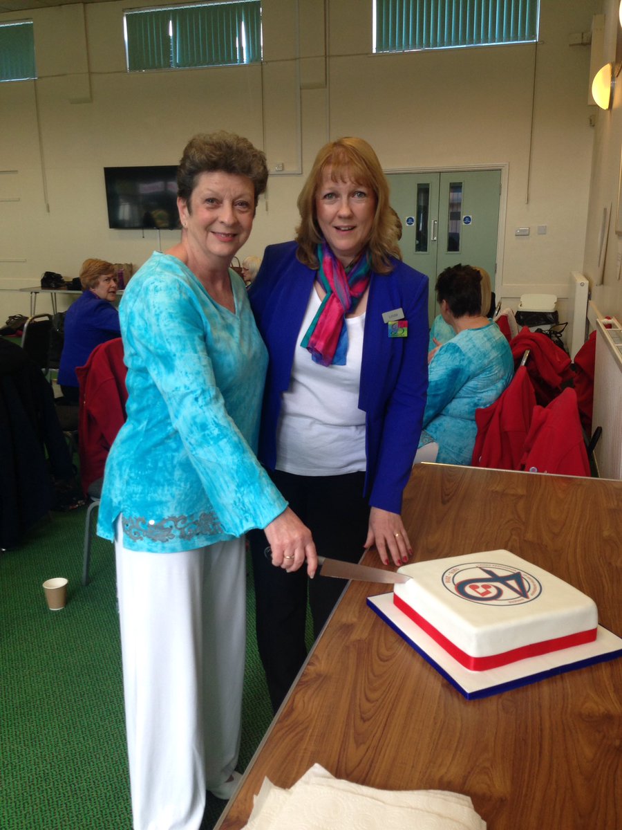Cutting the celebratory 40th Anniversary cake Linda Baugh Barberettes Chair &amp; Madeleine Branson The Arun Sounds MD