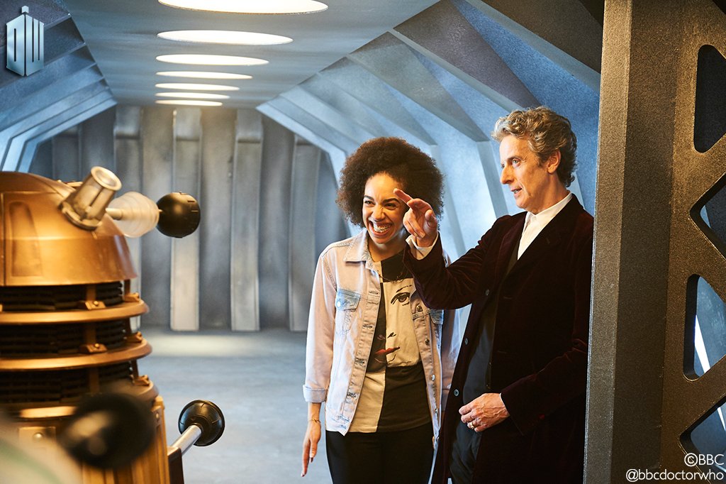 Pearl Mackie and Peter Capaldi filming a scene with a Dalek