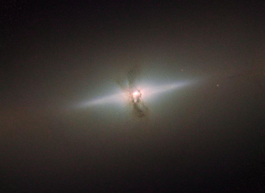 NASA's tweet image. Elegance of this galaxy may conceal a violent past - smaller galaxy swallowed up long ago: go.nasa.gov/1U9RPyr